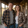 Adult couple smiling together on a farmhouse porch in Nebraska
